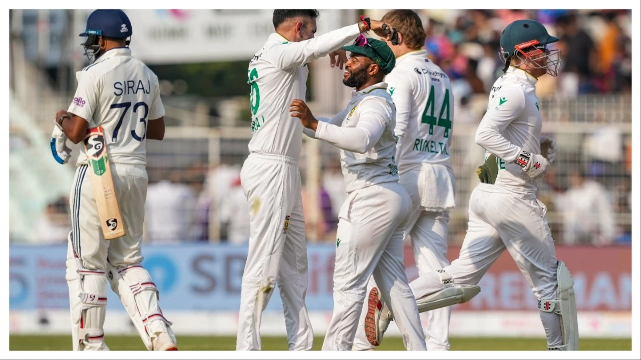 South Africa's Temba Bavuma with teammates celebrates after their ein over India in Kolkata on Sunday.