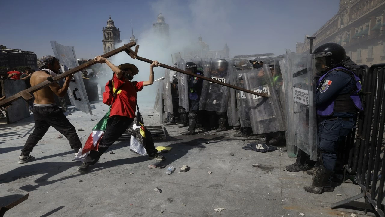 Members of Generation Z in Mexico City, Mexico, on November 15, 2025, clash with police in the Zocalo, the city&#039;s main square.