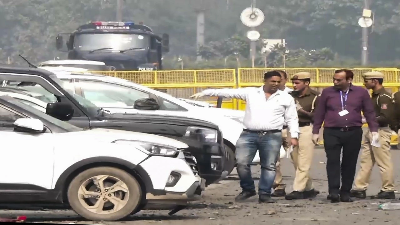 Officials inspect cars damaged in the blast near the Red Fort in New Delhi on Wednesday. (PTI Photo)