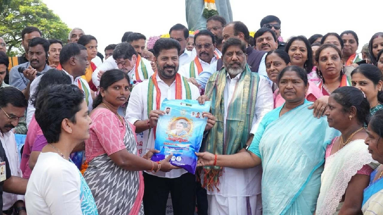 Telangana CM Revanth Reddy distributes sarees at Necklace Road, Hyderabad. 