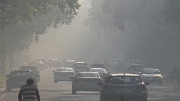 Vehicles ply on a road amid smog as air quality remains in the 'poor' category, near Kartavya Path in New Delhi, on Wednesday, Nov. 19, 2025. (PTI Photo/Karma Bhutia)