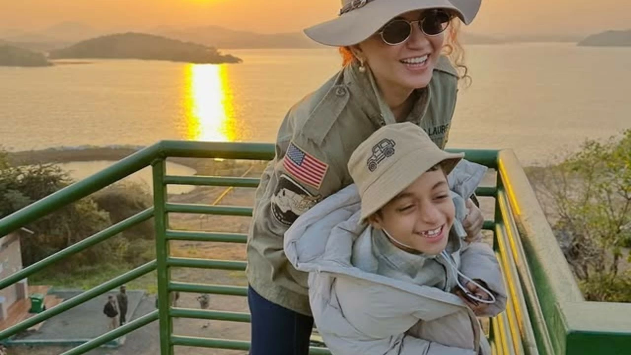 She wore a safari jacket and hat, looking jungle-ready while holding binoculars.