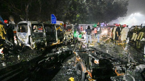 Here is the grammatically improved sentence:

Another officer said they are still working to confirm the real identities of the members, many of whom used pseudonyms and code words
