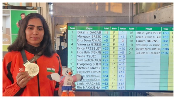 Diksha Dagar celebrates with her gold medal on Thursday.