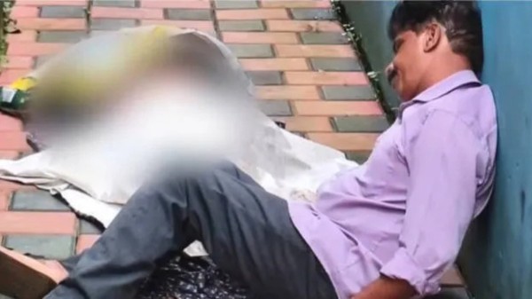 Sanitation worker found the woman lying on the tiled courtyard with the owner sitting near her body