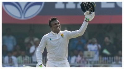 Senuran Muthusamy celebrates his century on Sunday.
