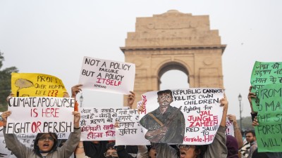 People raise slogans during a protest against worsening air quality in the national capital on Sunday.