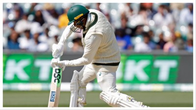 Usman Khawaja plays a shot during the second Test between Australia and India in Adelaide on Dec. 8.
