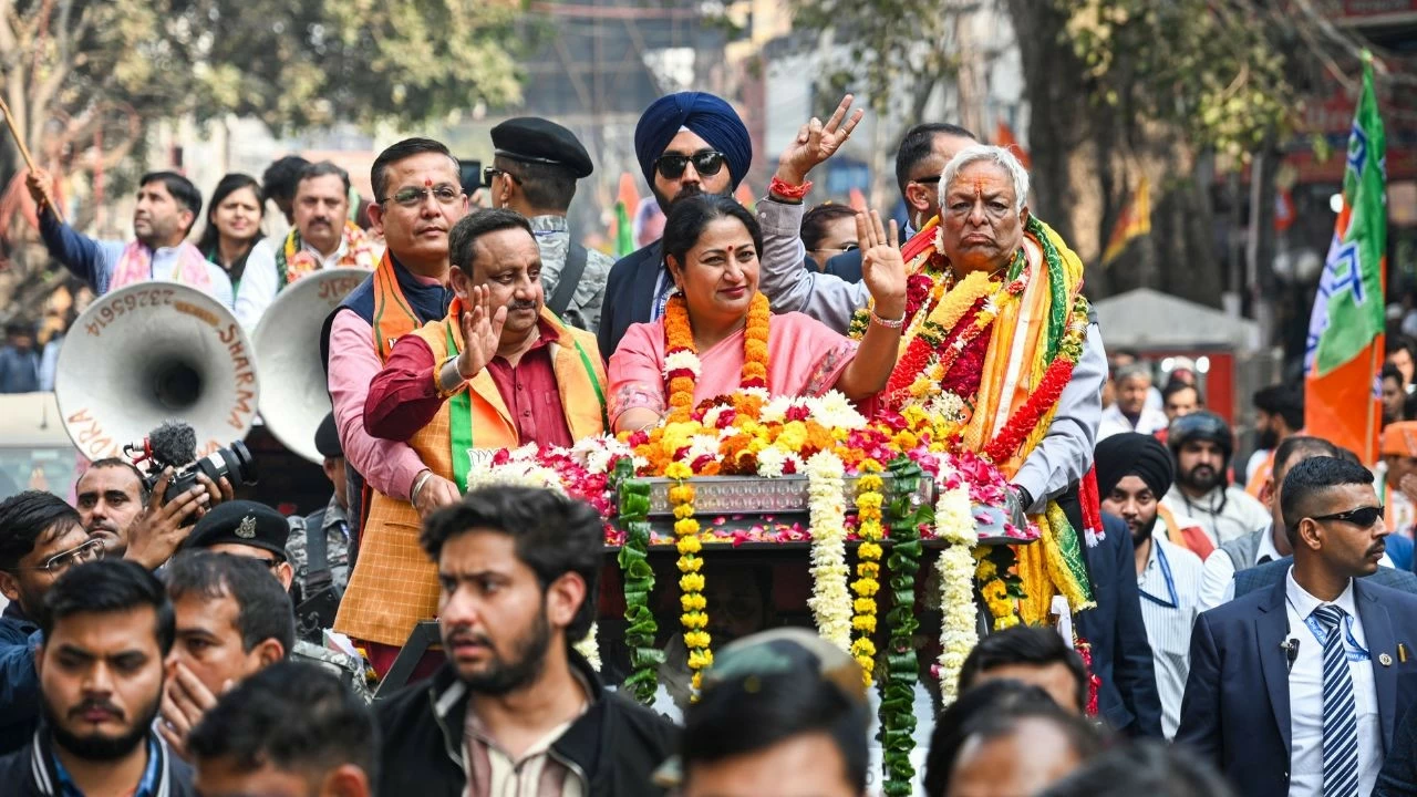 Delhi Chief Minister Rekha Gupta during a roadshow in support of BJP candidate from Chandni Chowk seat, Suman Kumar Gupta, right, ahead of the Municipal Corporation of Delhi (MCD) bypolls, in New Delhi
