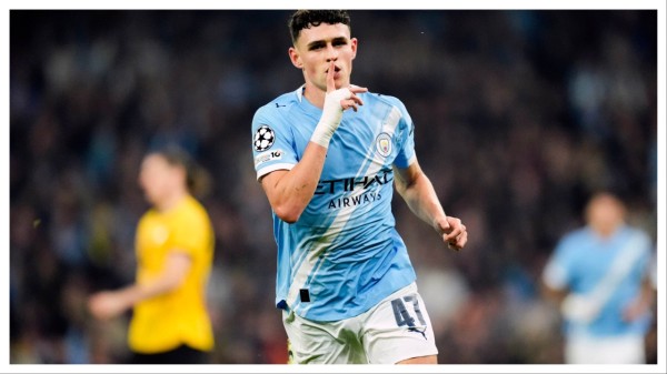 Manchester City's Phil Foden celebrates after scoring.
