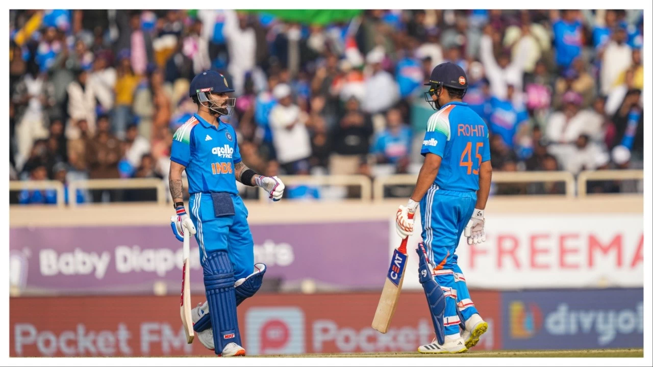 Virat Kohli, left, celebrates his half century with Rohit Sharma in Ranchi on Nov. 30.