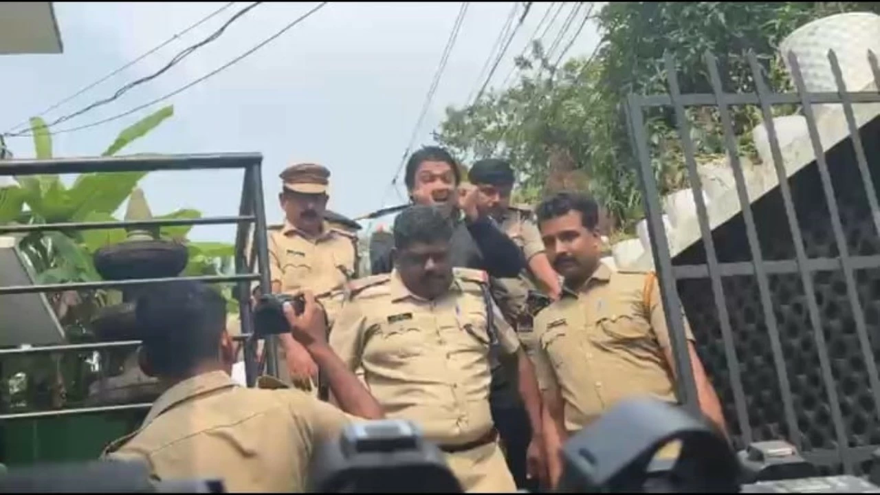 Rahul Easwar being taken out from his house after evidence collection in Trivandrum