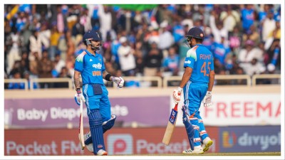 Virat Kohli, left, celebrates his half century with Rohit Sharma in Ranchi on Nov. 30.