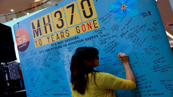 Relatives of passengers from the Malaysia Airlines flight that mysteriously vanished 10 years ago are writing messages at the Day of Remembrance for MH370 in Petaling Jaya, Malaysia, on March 3, 2024.