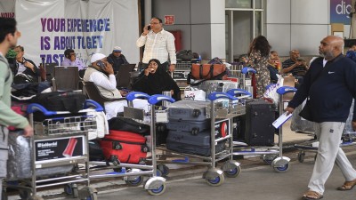 Stranded passengers at Chhatrapati Shivaji Maharaj International Airport amid IndiGo flight disruptions in Mumbai on Saturday.