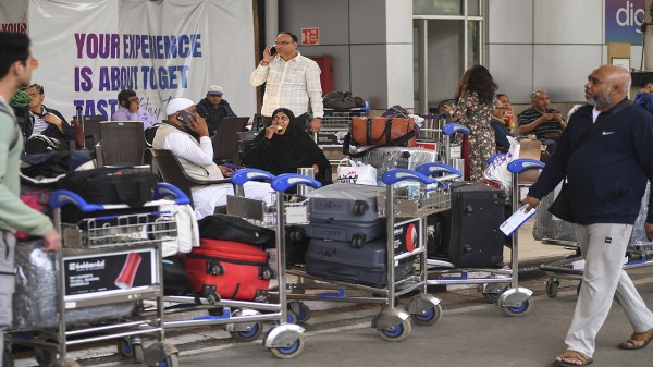 Stranded passengers at Chhatrapati Shivaji Maharaj International Airport amid IndiGo flight disruptions in Mumbai on Saturday.