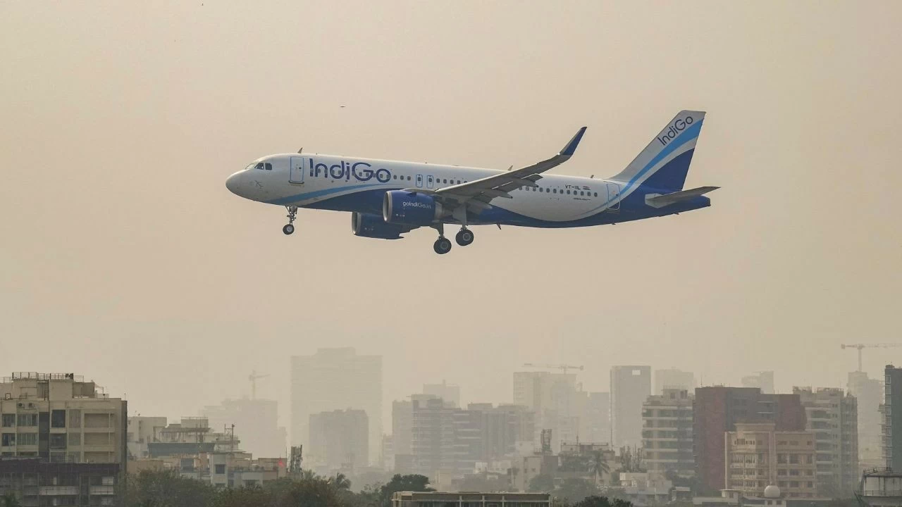 An IndiGo aircraft prepares to land at an airport, in Mumbai, Saturday, Dec. 6, 2025