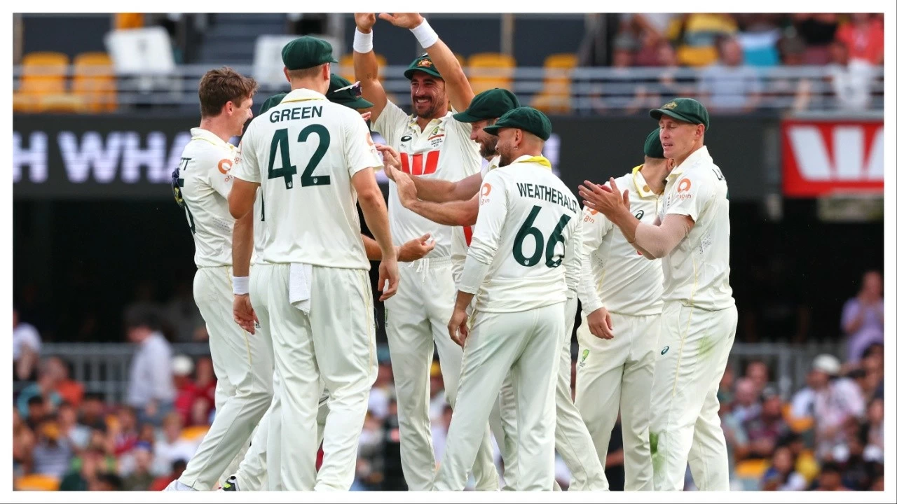 Australia&#039;s players celebrate the wicket of England&#039;s Gus Atkinson during the second Ashes Test in Brisbane on Dec. 7.