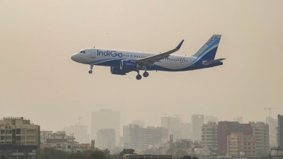 An IndiGo aircraft prepares to land at an airport, in Mumbai, Saturday, Dec. 6, 2025
