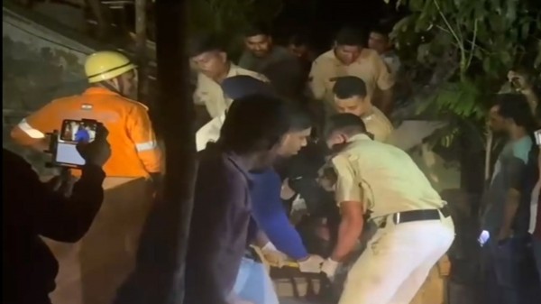 A victim being rescued after a fire broke out at a nightclub late Saturday night in North Goa.