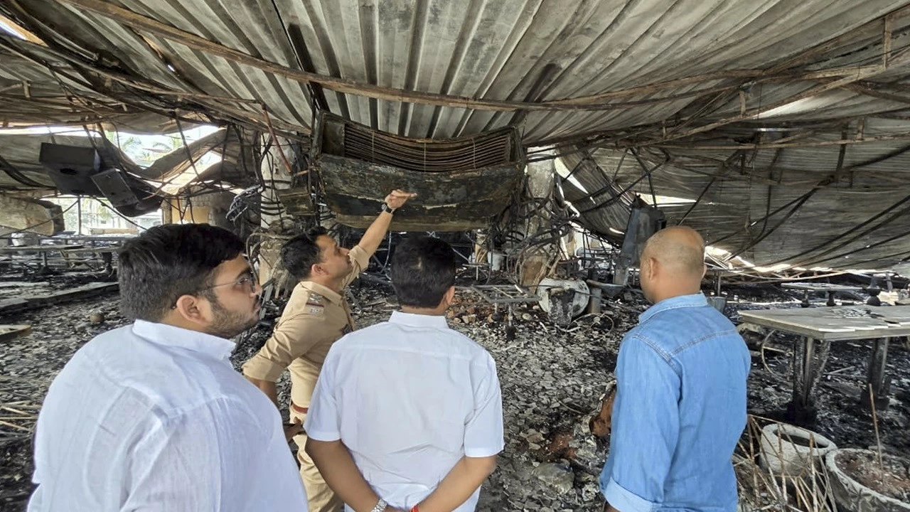 Officials inspect the charred remains of the nightclub after a fire broke out in North Goa district, Sunday, Dec. 7, 2025. At least 25 persons were killed and six others suffered injuries in the incident, according to officials. (PTI Photo) 