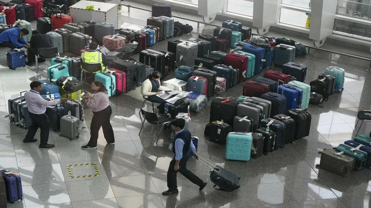 Luggage of passengers piled up at the Indira Gandhi International Airport amid IndiGo flight disruptions in New Delhi on Monday.