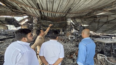 Officials inspect the charred remains of the nightclub after a fire broke out in North Goa district, Sunday, Dec. 7, 2025. At least 25 persons were killed and six others suffered injuries in the incident, according to officials. (PTI Photo) 