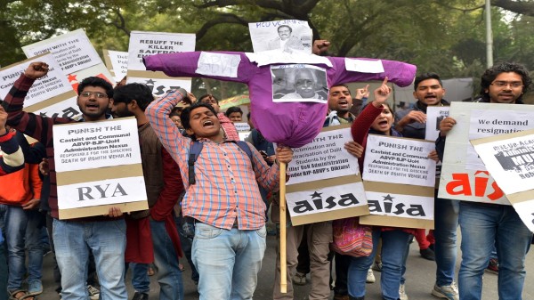 AISA students shout slogans with an effigy of Union Minister Bandaru Dattatreya during a protest against the suicide of Research scholar Rohit Vemula at Jantar Mantar in New Delhi.(Photo by K Asif/The India Today Group via Getty Images)