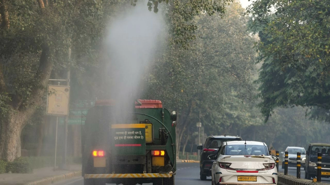 An anti-smog gun being used to spray water droplets to curb air pollution, in New Delhi