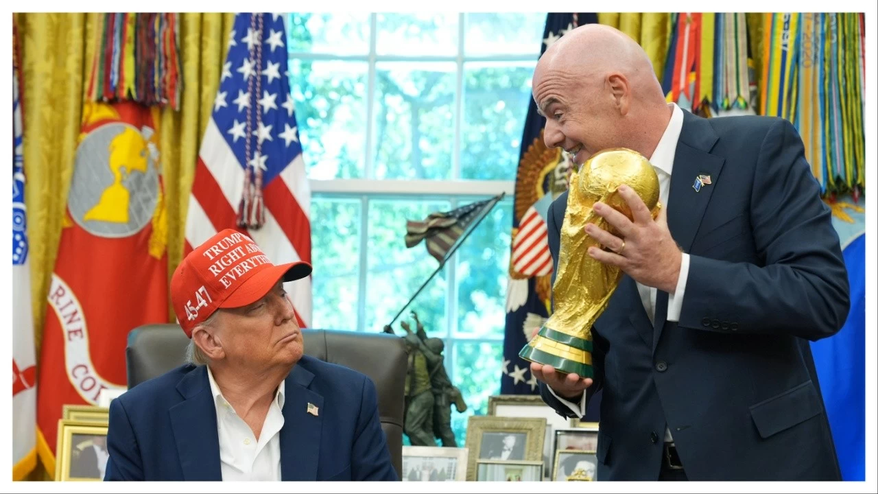 FIFA President Gianni Infantino, right, prepares to hand the FIFA World Cup trophy to US President Donald Trump on Aug. 22.
