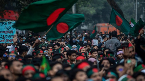 Students wave the Bangladesh flag during the Anti-Discrimination Student Movement’s ‘March for Unity’ at Shaheed Minar.