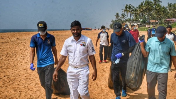 Indian Navy personnel along with volunteers cleaning up the Shanghumugham beach in Thiruvananthapuram
