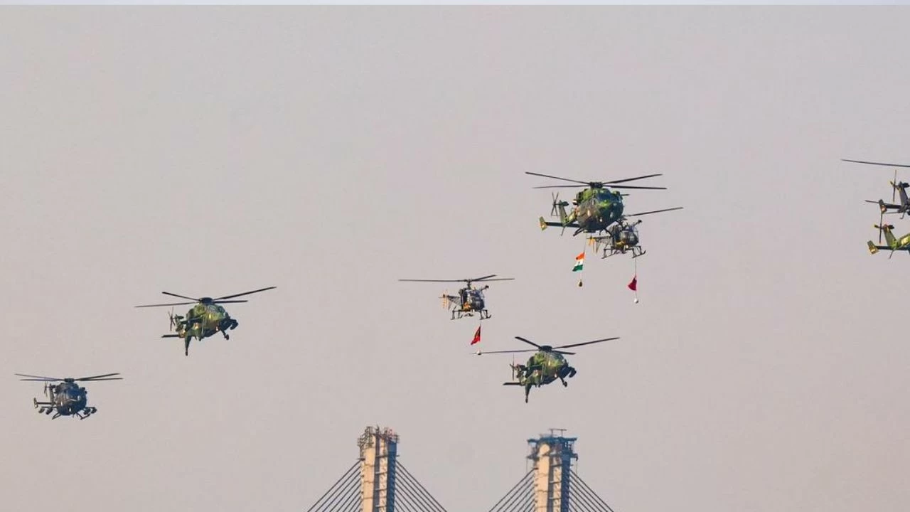 Army helicopters fly in formation during rehearsal drills at Kolkata’s Maidan ahead of the Vijay Diwas celebrations and the Eastern Command’s military tattoo