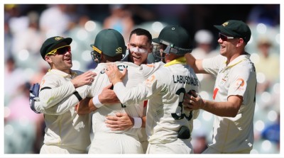 Australia's Scott Boland, centre, celebrates the wicket of England's Will Jacks with his teammates in Adelaide on Thursday.
