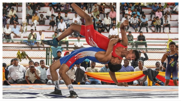 Players in action at a wrestling match during the 'Dasara' festival celebrations, in Mysuru on Sept. 24.