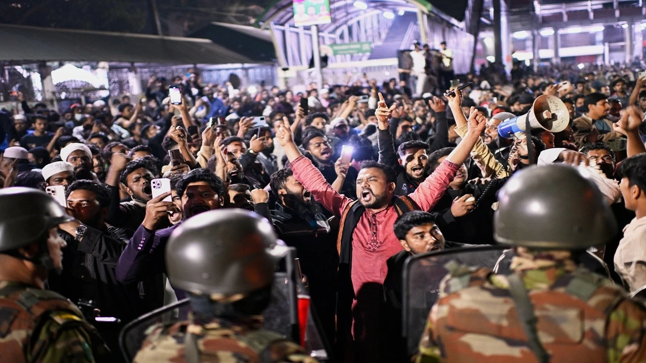 Protesters shout slogans in front of the premises of the Prothom Alo daily newspaper after news reached the country from Singapore of the death of a prominent activist Sharif Osman Hadi, in Dhaka, Bangladesh, on Friday, Dec. 19, 2025. (AP/PTI)