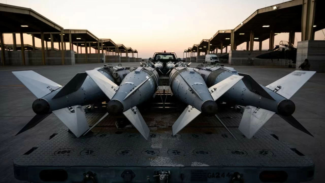 US Airmen prepare to load GBU-31 munition systems onto F-15E Strike Eagles within the US Central Command area of responsibility, December 19, 2025, in support of Operation Hawkeye Strike