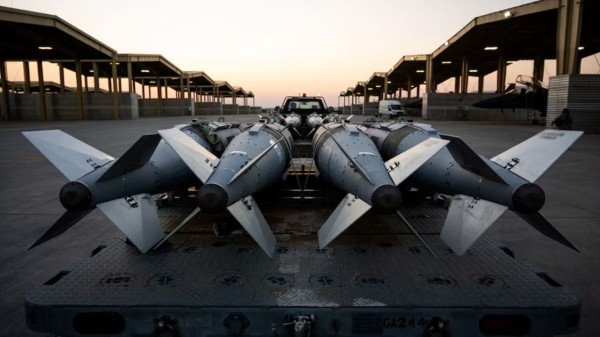 US Airmen prepare to load GBU-31 munition systems onto F-15E Strike Eagles within the US Central Command area of responsibility, December 19, 2025, in support of Operation Hawkeye Strike