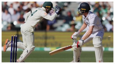England's Zak Crawley reacts after he was out stumped by Australia's Alex Carey, left, in Adelaide on Saturday.
