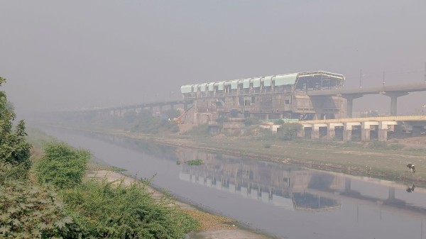 Smog engulfs the Jharoda Majra Metro Station station near Burari, in New Delhi