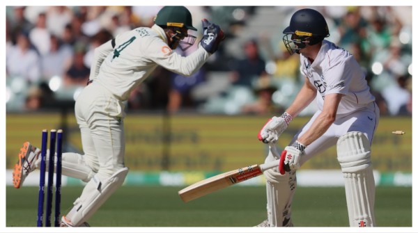 England's Zak Crawley reacts after he was out stumped by Australia's Alex Carey, left, in Adelaide on Saturday.
