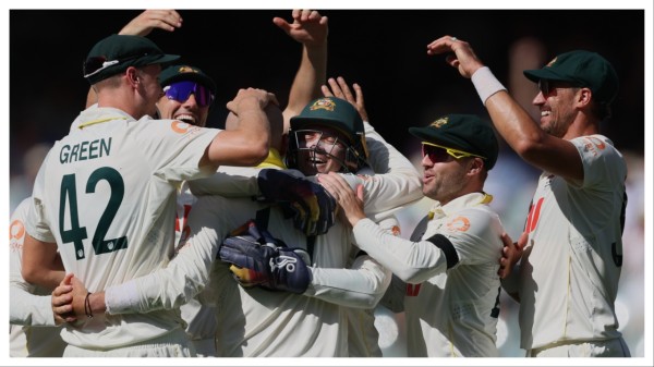 Australia's Nathan Lyon, third left, is congratulated by teammates after dismissing England's Ben Stokes in Adelaide on Dec. 20.