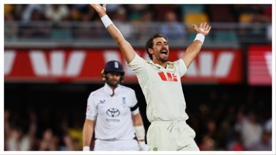 Australia's Mitchell Starc appeals successfully for the wicket of England's Joe Root, left, in the second Ashes Test in Brisbane on Dec. 6.