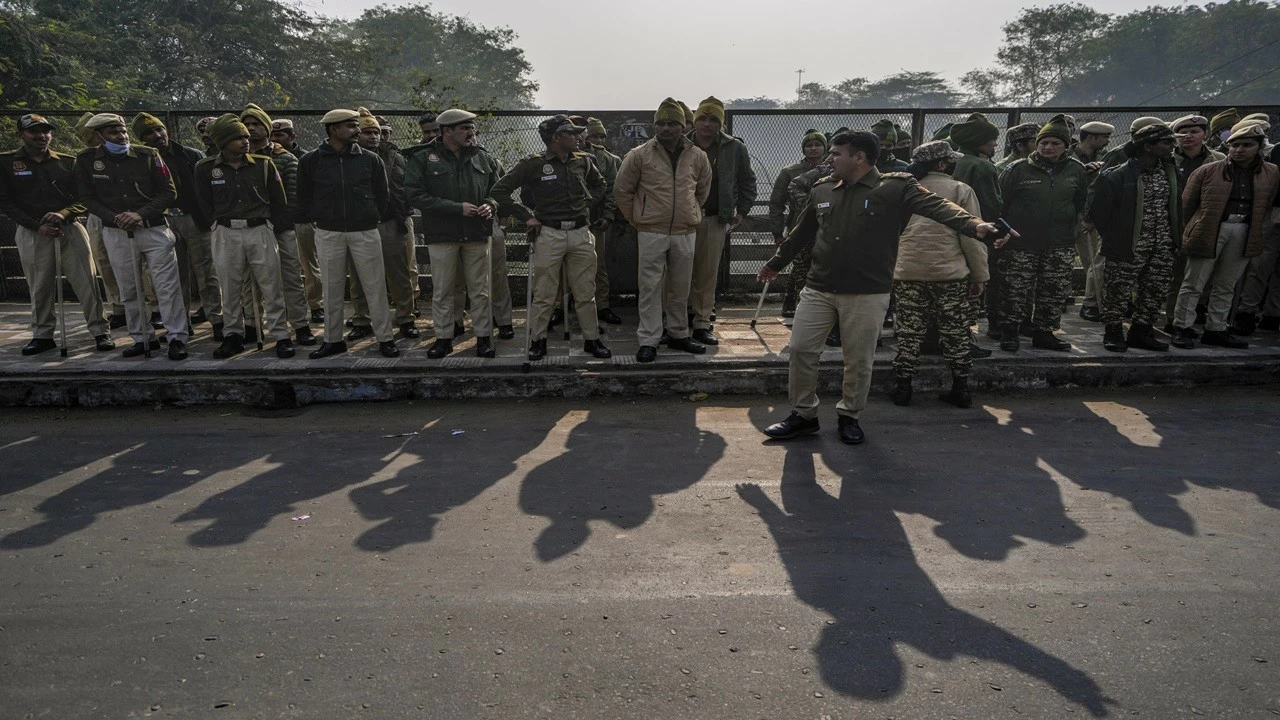 Police personnel stand guard near the Bangladesh High Commission in view of a protest against the alleged attacks on Hindus in Bangladesh, in New Delhi on Tuesday. 