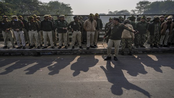 Police personnel stand guard near the Bangladesh High Commission in view of a protest against the alleged attacks on Hindus in Bangladesh, in New Delhi on Tuesday. 