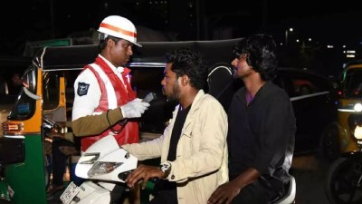 Police carry out breath analyser tests on citizens 