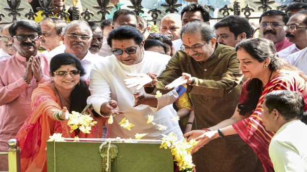 Shiv Sena (UBT) chief Uddhav Thackeray with MNS President Raj Thackeray and others pay tribute to Shiv Sena founder Bal Thackeray, in Mumbai, on Wednesday. (PTI Photo)