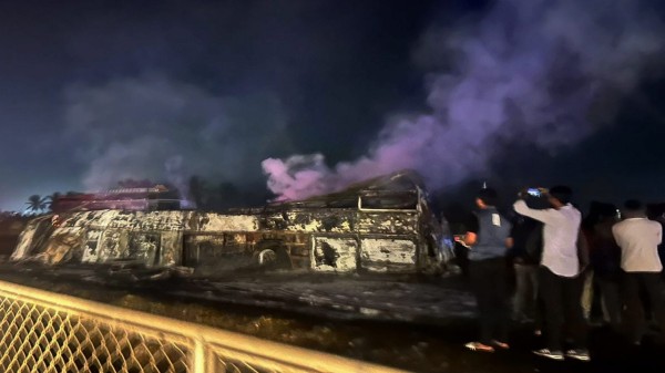 Charred remains of a bus after it caught fire following the collision with a speeding truck, in Chitradurga. (PTI Photo)