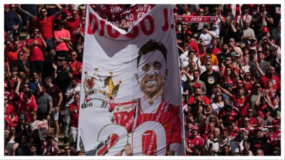 Liverpool fans hold a banner in the memory of Diogo Jota.