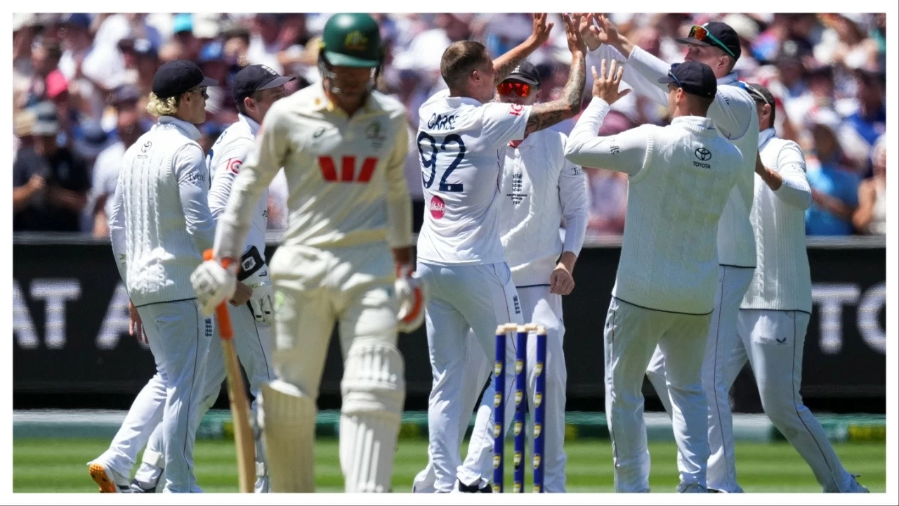 England celebrates after Brydon Carse gets the wicket of Australia's Alex Carey.